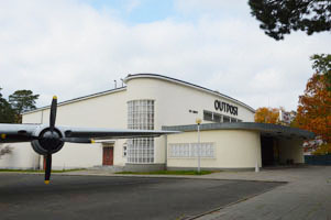 The Outpost Theatre and the propeller raisin bomber at the Allied Museum.