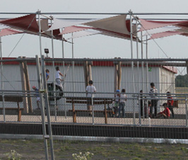 On the Tempelhofer Feld: the playground of the container village for refugees.